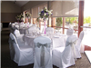 The ballroom is decorated for a wedding reception