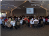 Guests attend a business meeting in the ballroom