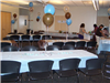 Balloons and decorations fill the room for a party