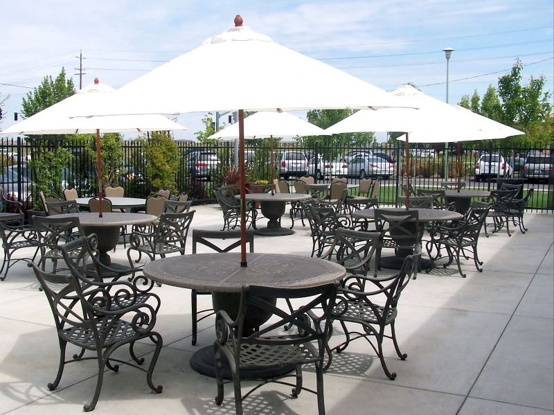 Chairs and tables are setup in the patio off from the ballroom