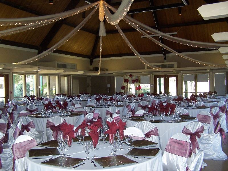 The reception hall is decorated in flowers and streamers for a wedding