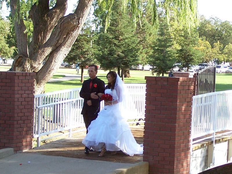 A bride escorted across the bridge onto the island