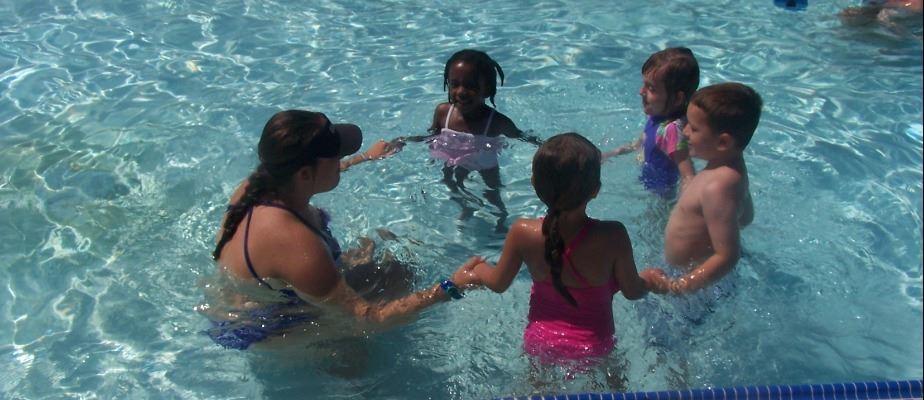 Children in a circle during swim lessons