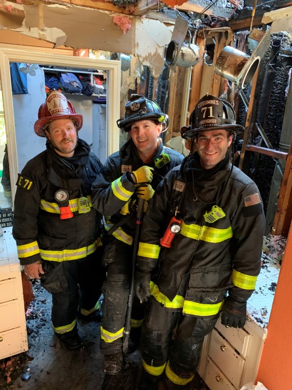 Firefighters taking a moment to rest after a fire