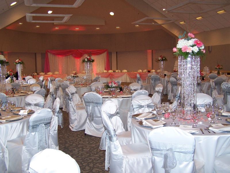 The ballroom is decorated for a wedding reception