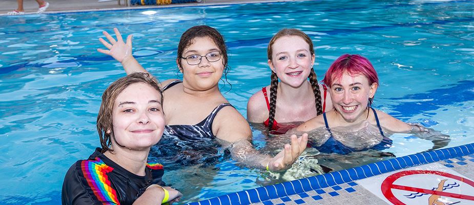 Four teens in the pool at Late Night Event