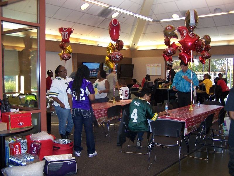 Guests attend a sports party at the teen center