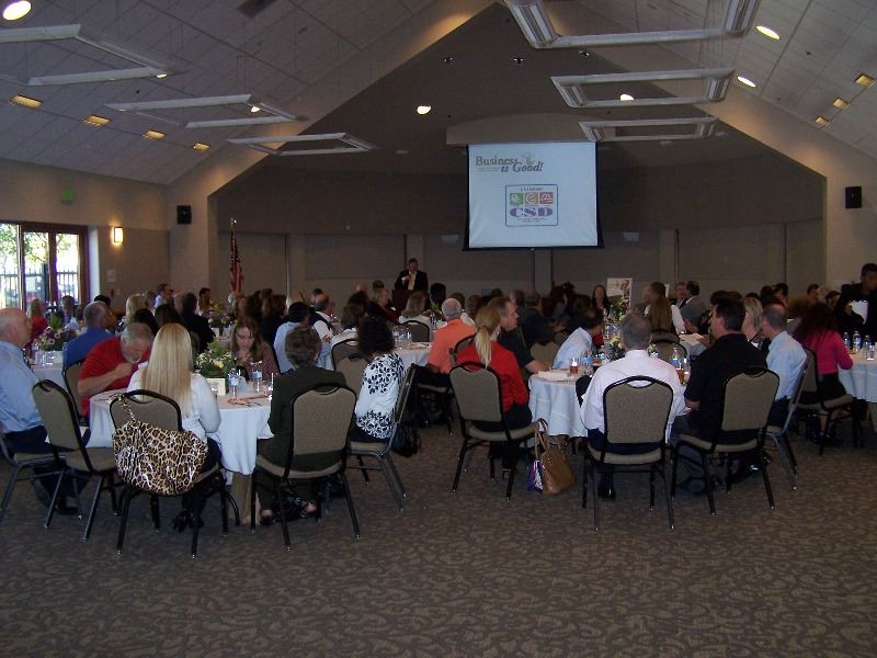 Guests attend a business meeting in the ballroom