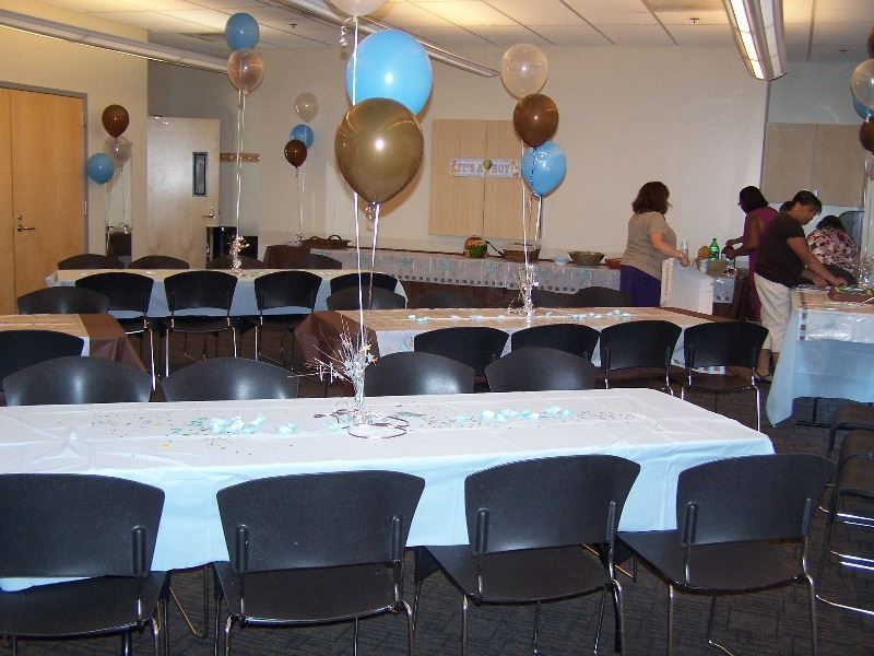 Balloons and decorations fill the room for a party