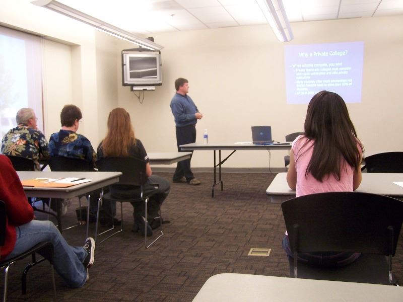 A renter leads a presentation during a community meeting