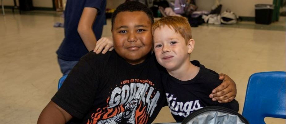 Two Boys Side Hugging